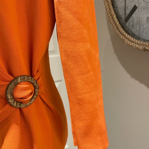 Beautiful wrap top in a striking tangerine color. - Picture 3 of 7